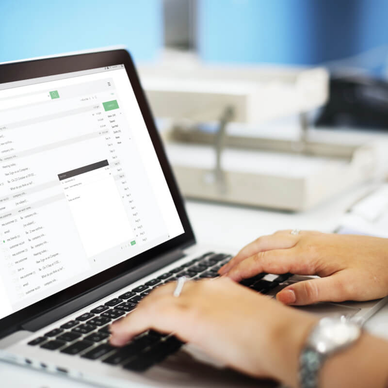 someone writing an email on the computer