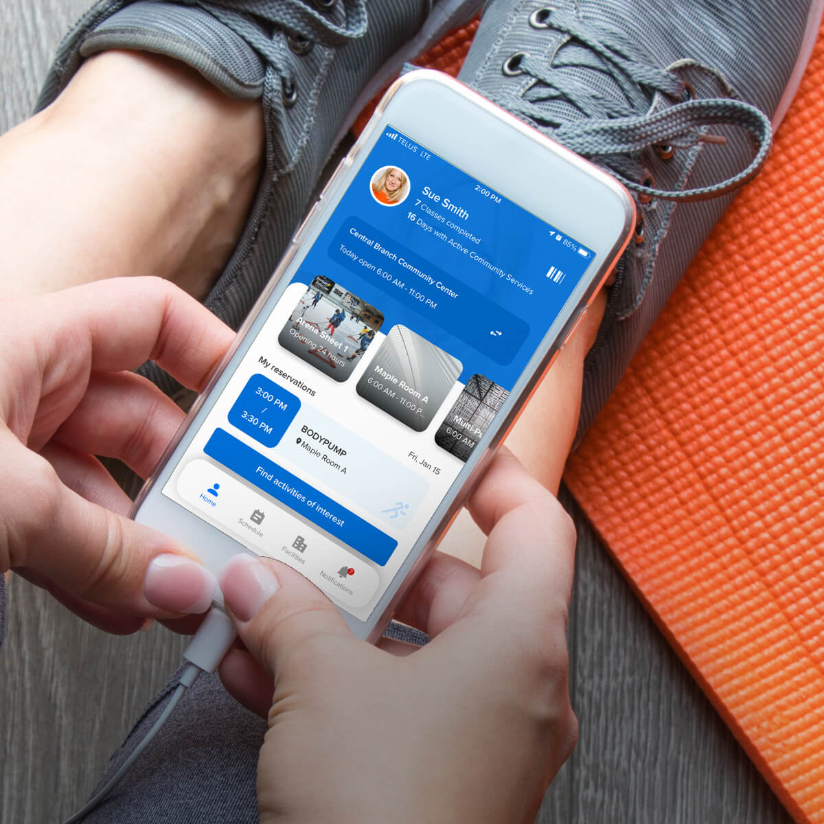 person at gym using active captivate app to register for a class
