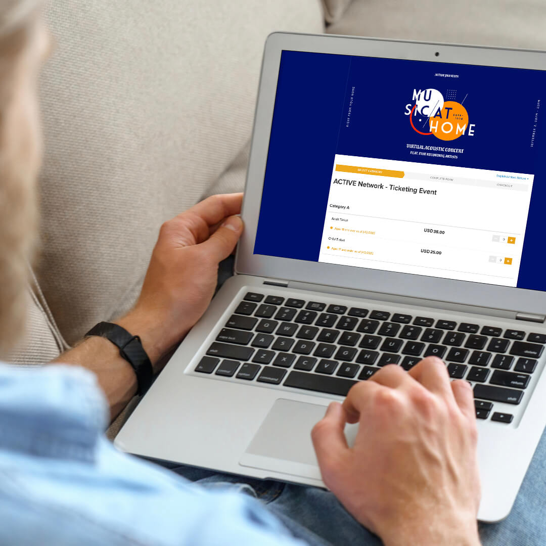 Man registering for a concert on his laptop