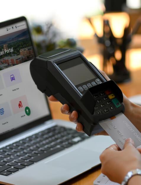 women at rec center front desk greeting members