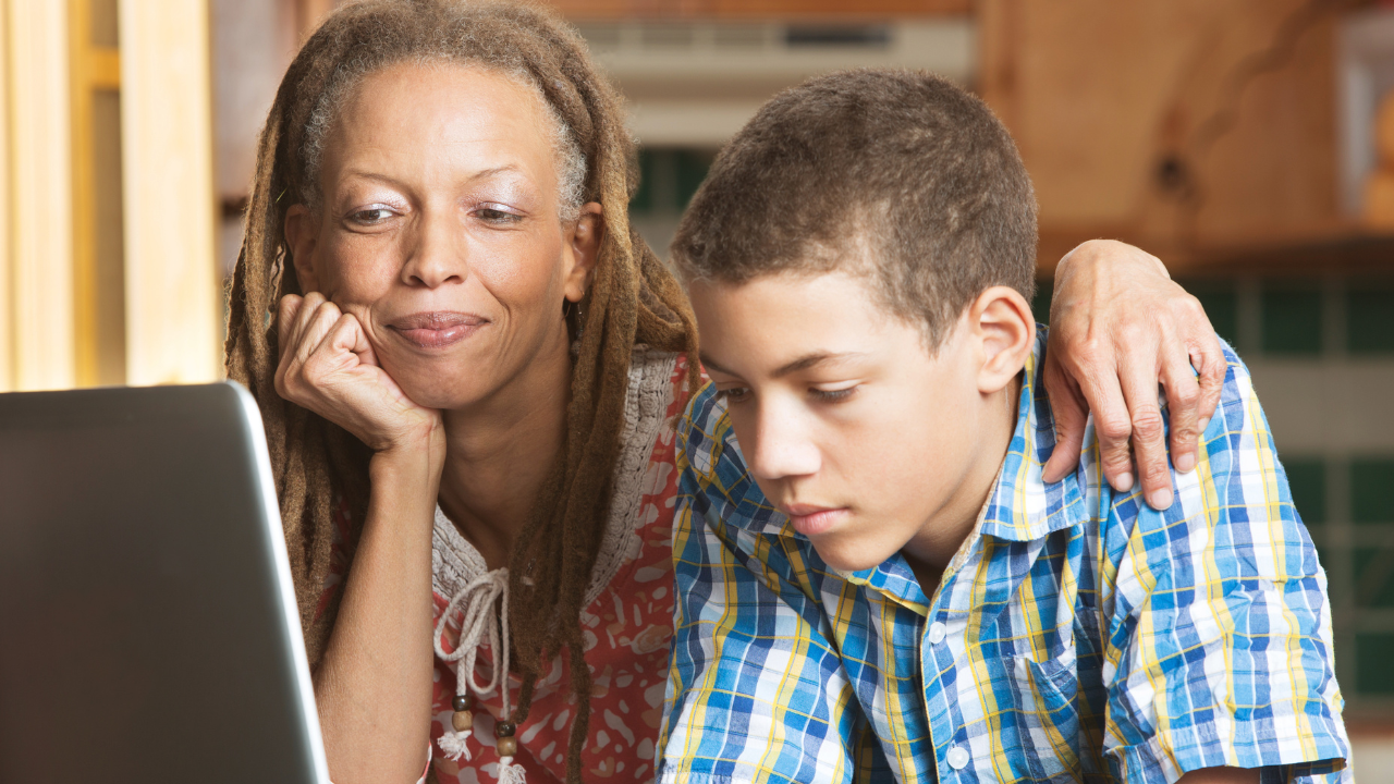 mother and son looking at a laptop